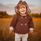 Couture de gilet, veste et peignoir pour bébé 