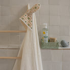 Cape de bain bébé floral et blanc